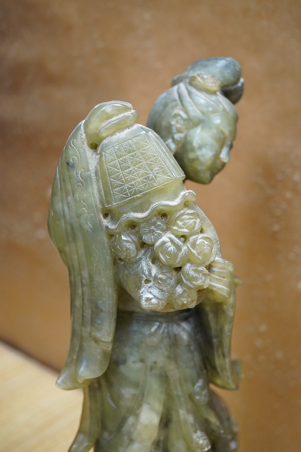 A Chinese carved green soapstone figure of Guanyin, 34cm high. Condition - fair to good